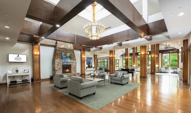 lounge with seating fireplace and tv