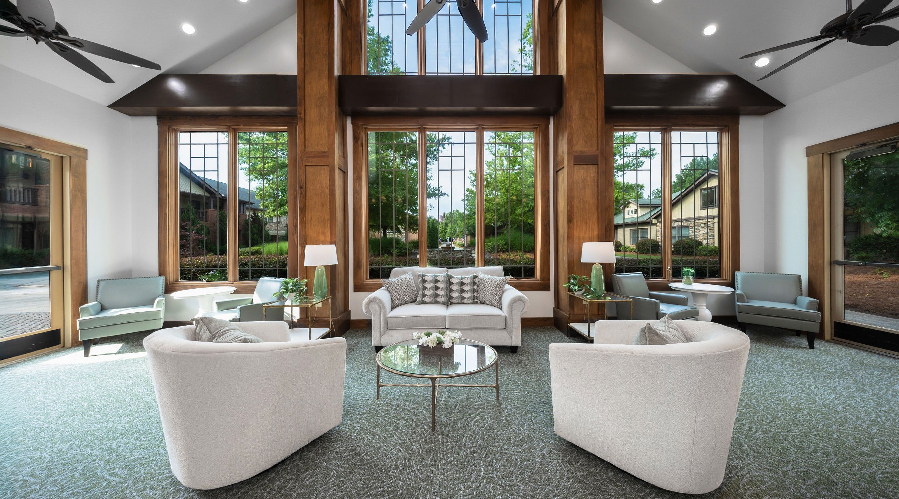 lounge with wood beams seating and large windows