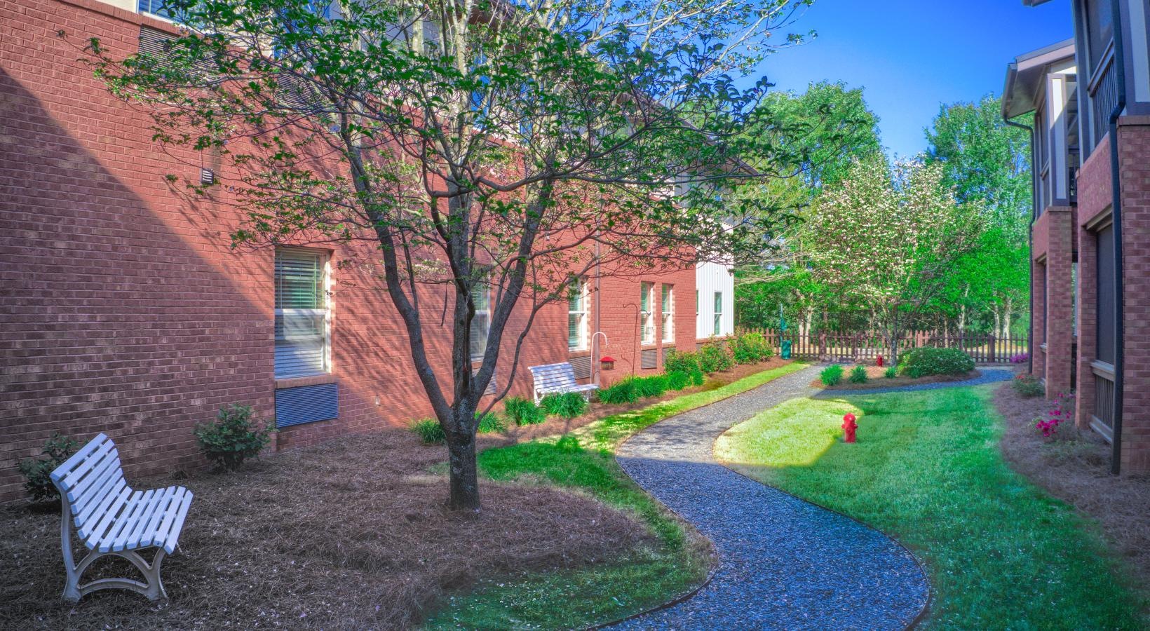 Find your perfect fit at King's Reserve Suwanee a bench in a yard
