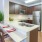 a kitchen with a table and chairs