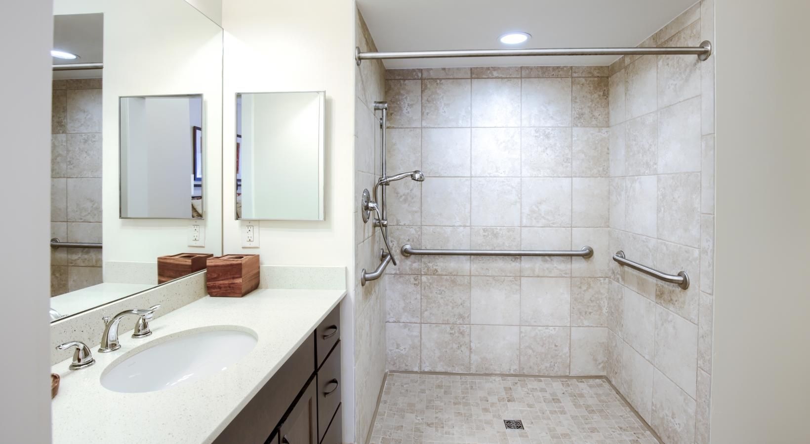 Spacious bathrooms with everything you need a bathroom with a sink and a shower unit