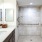 a bathroom with a sink and a shower unit