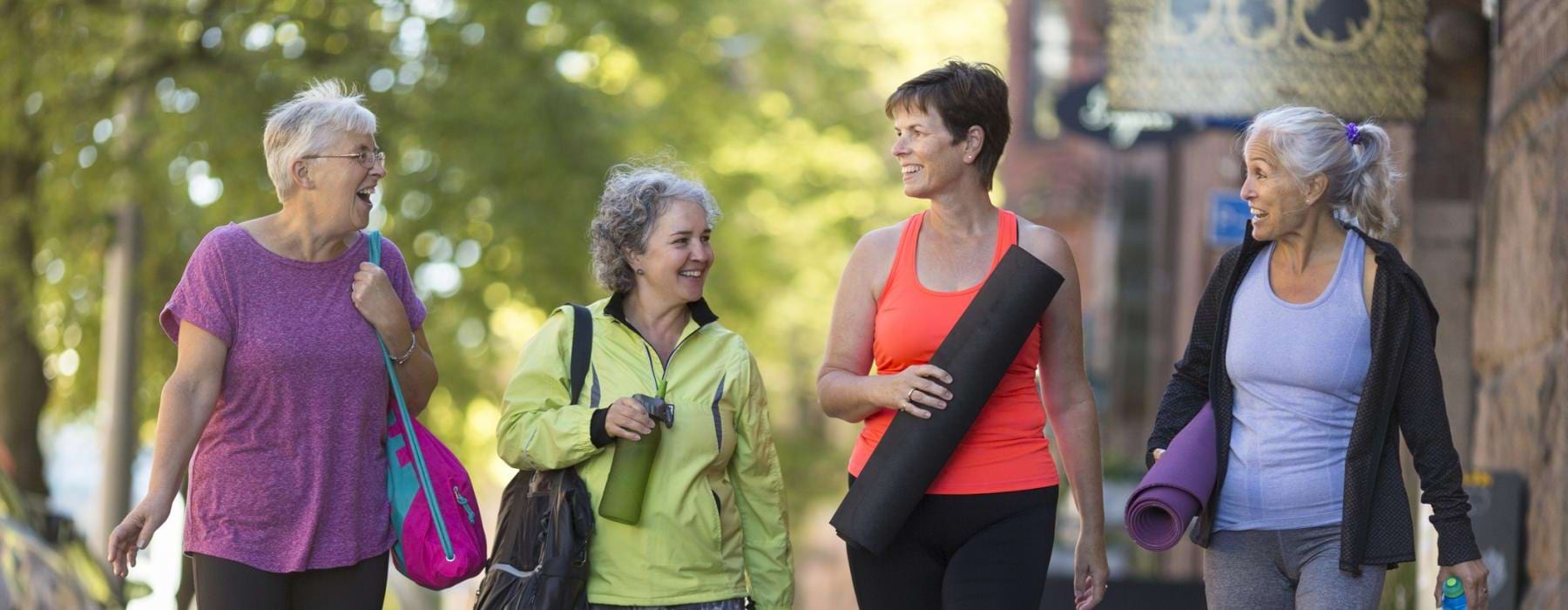 a group of women walking on a street